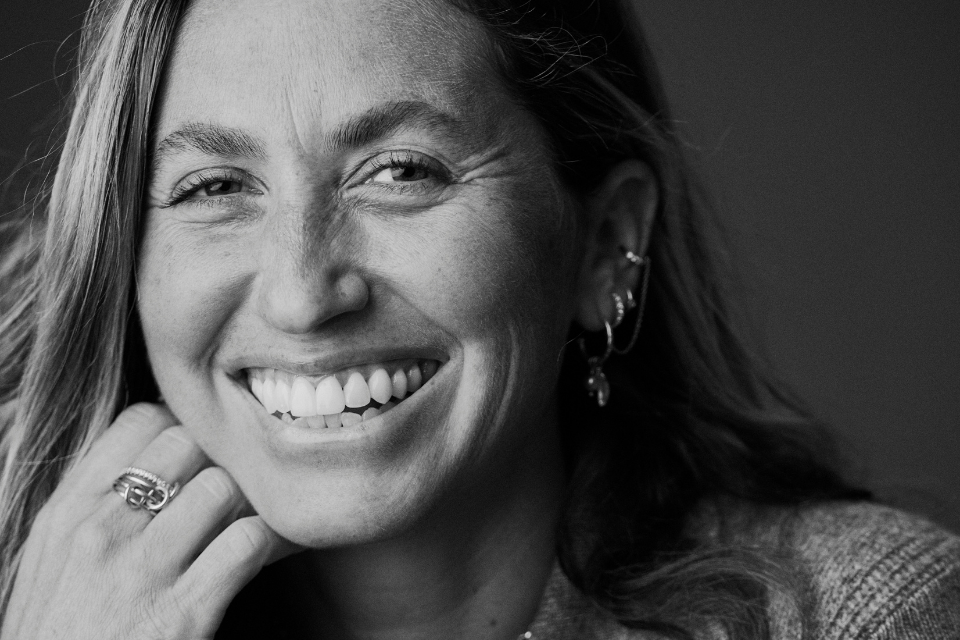 woman smiling in black and white